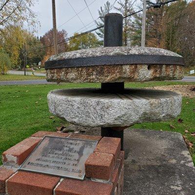 Mill stone in front of municipal office