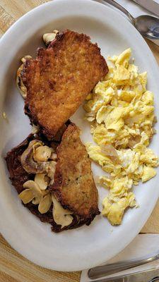 Mushroom and cheese stuffed potato pancake with scrambled eggs.