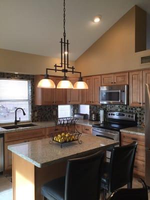 Lovely birch cabinets and light granite countertops definitely updated a 25 yr old kitchen.