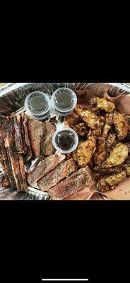 Smoked Brisket sold by the pound, Smoked pork ribs and smoked chicken wings