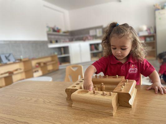 Knobbed cylinder lesson toddler class