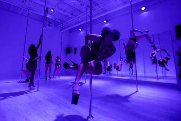 Pole dance classes keep the lights low and the music loud