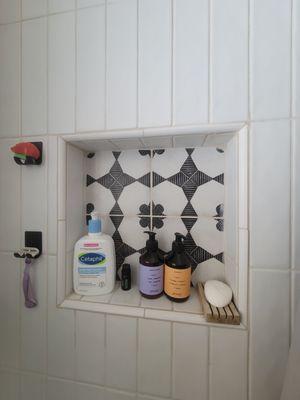 tilework in shower with niche shelving