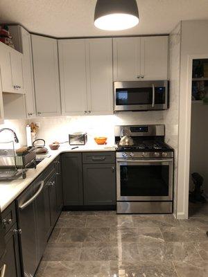 New flooring, overhead lighting.  Kitchen in use!