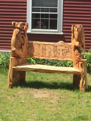 Great bench made with a chainsaw. You can also see the guy who makes these in action at the Brockton fair!  Amazing!!