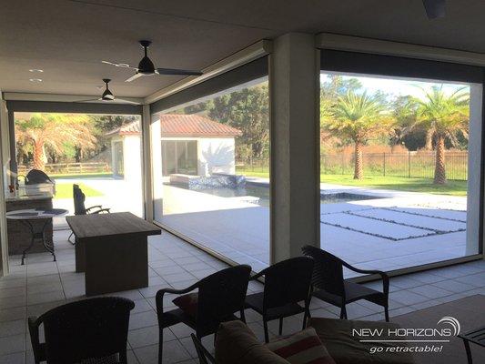 Electric patio screens provide shade and insect control without blocking the view!