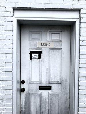 Photo of address on the door showing 7221-C. This auto shop is behind another business at 7221 Little River Turnpike, hard to see on maps.