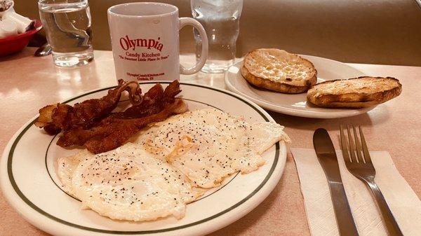 Bacon, two eggs over easy, with eglish muffin and coffee...