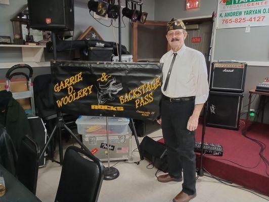 Garrie Woolery with band sign