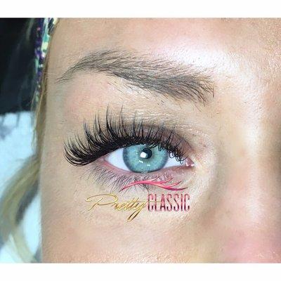 This is a "Pretty Full" Lash Extension Set. This lash set was customized based on the client's natural eye shape.