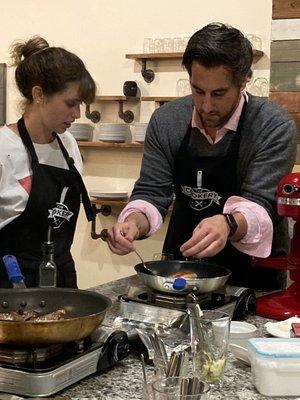 Chef Peter showing how to butter baste We had one attendee who didn't eat steak and they accommodated her with salmon!