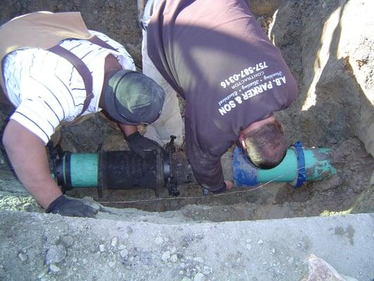 Bob Miller & Johnny Lamb repairing a busted 6" fire main at TGI fridays