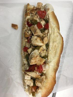 Chicken cheesesteak with onions, papers and tomatoes