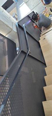 Perforated steel sheets panels and handrail for stairs