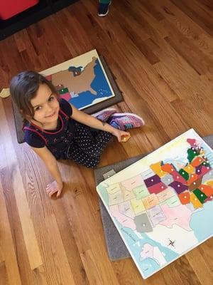 One of our students using a USA puzzle map.