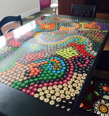 Custom bottle cap dining table, just one of many original pieces of art on the property.