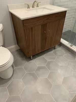 Bathroom floor: Soho Studio Elementary Gris with Laticrete Permacolor grout in Silver Shadow