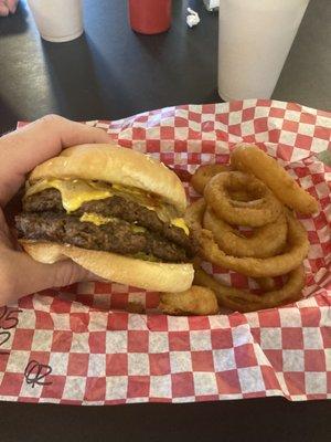 Double cheeseburger with onion rings.