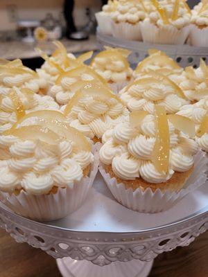 Golden Chiffon Cupcakes topped with candied lemon garnish.