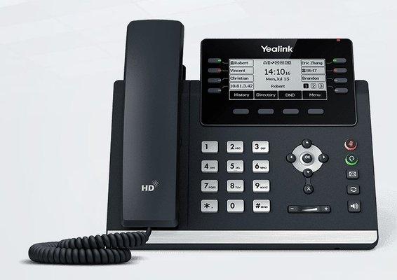 Yealink T43 VoIP phone that can handle up to 12 lines at a time.