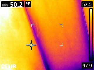 FLIR Thermogram shows cold to hot air convection around an entry door.  IR tools and the knowledge to use them result in lower utility costs