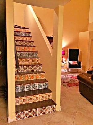 Southwest charm was added to this staircase with colorful Talavera tiles, and rich wood.