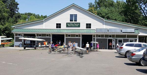 A sunny day at the Holyoke Rows boathouse. Boats are pulled out of the bays ready to be brought down to the docks.