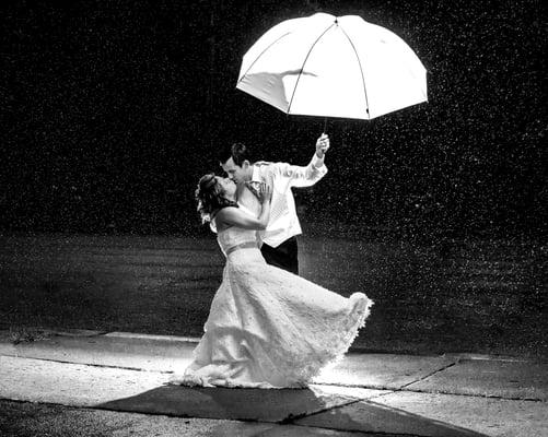 Around 11PM on our wedding night, Ron asked for a few minutes during our reception and dancing, to take this shot in the rain.