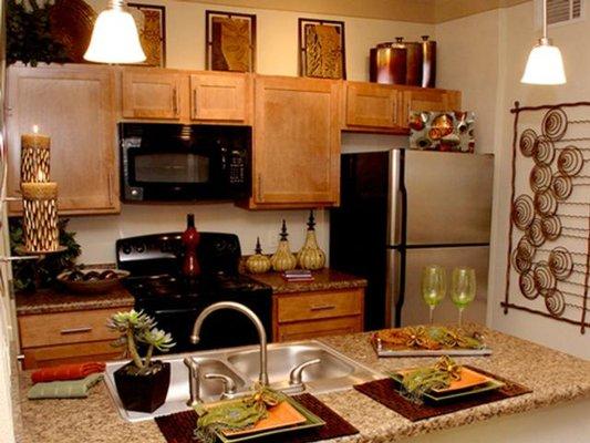 Enjoy cooking gourment meals in your new kitchen at Riverside at Rockwater Apartments.