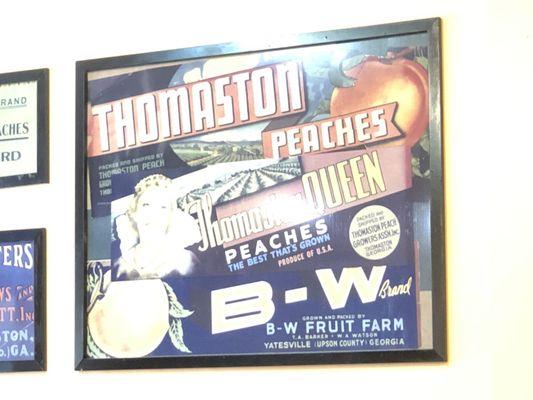 A local peach packer crate label displayed on the patio wall.