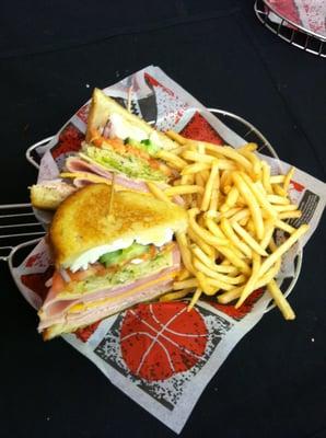 Signature Chef Salad Sandwich: Turkey, Ham, Swiss, Cheddar, Lettuce, Tomato, Cucumber, hard-boiled eggs on toasted sourdough.