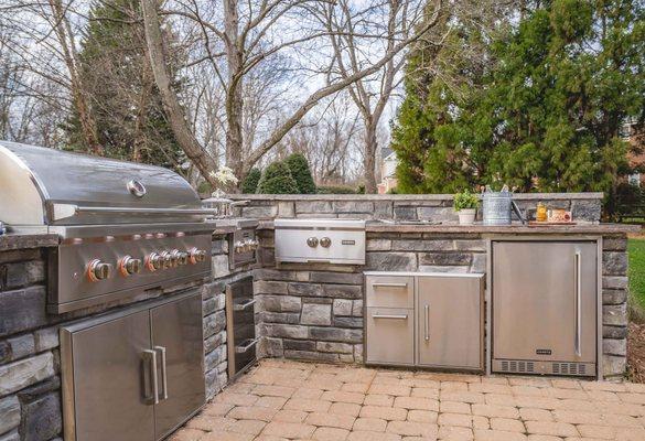 L-Shaped Kitchen made with the ClifRock Engineered Panel System.  Coyote Outdoor Living appliances.