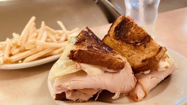 Smoked Turkey on Raisin Toast w/ Swiss Cheese - 1/2 order French fries... delicious!