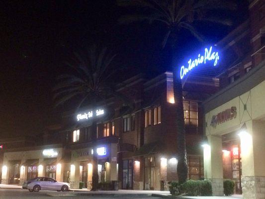 Ontario Plaza shopping center at night.