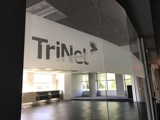 TriNet logo cut out of White Frost film on interior conference glass walls.