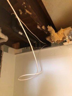 Exposed wires, missing ceiling tiles