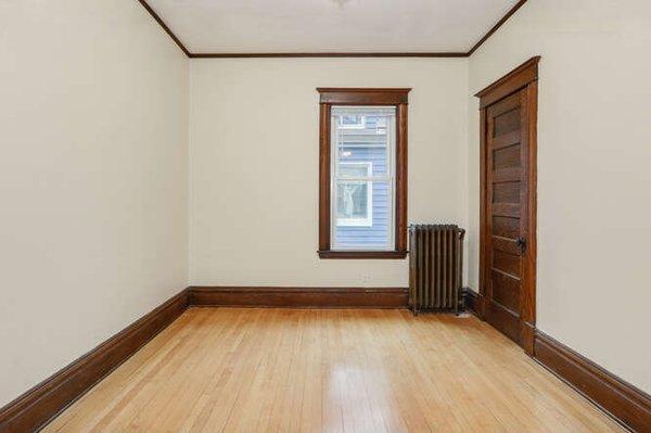 Bedroom with wood floors