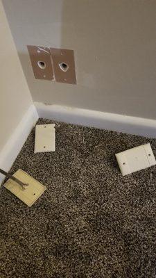 Screws, plates, wires on floor. Holes in wall not covered.