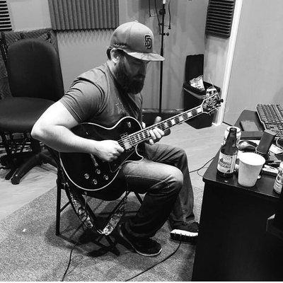 Owner and Operator Tom Jeffrey recording guitar parts for a client at Star Lux Studio.