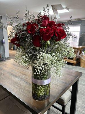 Red Roses with baby's breath and lavender colored filling