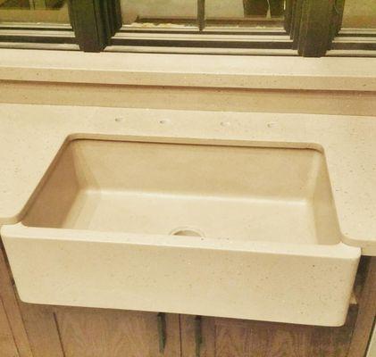 Integral Farmhouse Style Sink in Kitchen Concrete Countertop.