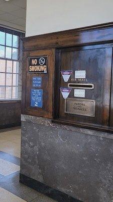 view of woodwork and stonework within interior of post office