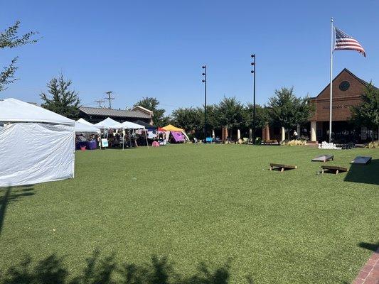 Nice open area and yard games. Vendors on the perimeter and behind this pic