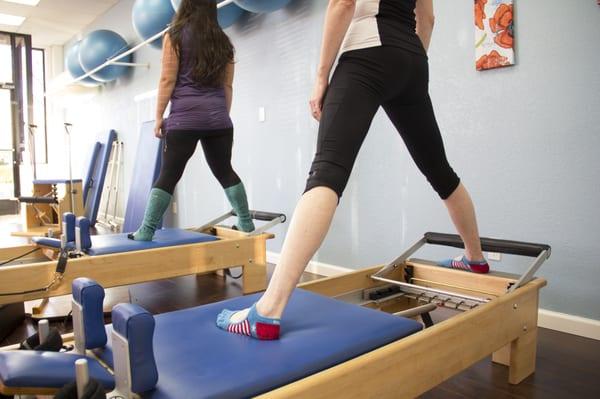 Professional instruction and quality equipment ensure a rewarding Pilates workout.