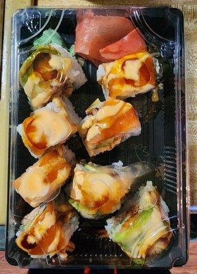 Iron Grill Roll: spicy crab meat, avocado, grilled salmon, salmon & avocado on top with eel spicy mayo