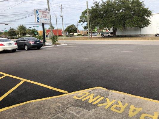 Updated store front: road has been paved and new cement!