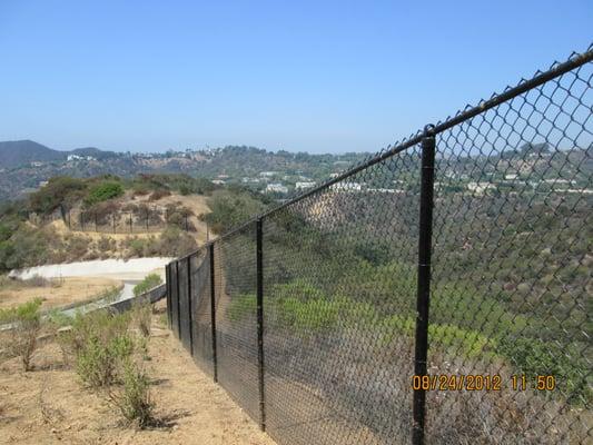 hillside vinyl coated chain link fence with top rail