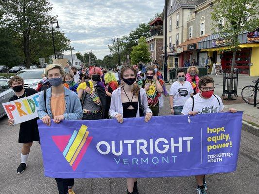 Youth marching with Outright at Pride 2022