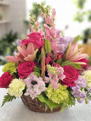 Natural willow basket with vibrant blooms