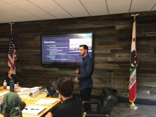 Joseph giving a presentation on Food Allergies for the School District Regional Office